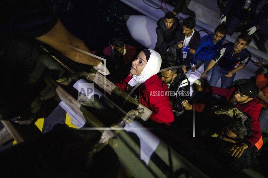 Petros Giannakouris FILE - In this Thursday, Sept. 26, 2019 file photo, an Iraqi woman boards a coast guard ship during a rescue operation near the Greek island of Samos. Five years on, the deal between European Union and Turkey is no longer working but at a summit next week EU leaders will discuss ways to improve relations with Turkey and could try to revive the agreement. (AP Photo/Petros Giannakouris, File)