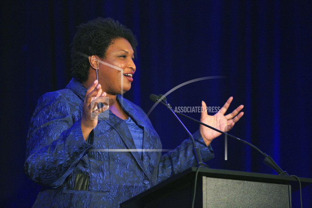Akili-Casundria Ramsess Stacey Abrams addresses the Gwinnett County Democratic Party fundraiser on Saturday, May 21, 2022, in Norcross, Ga. (AP Photo/Akili-Casundria Ramsess)