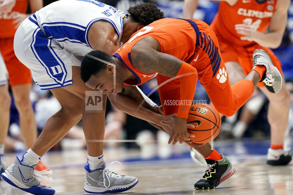 Gerry Broome Duke forward Wendell Moore Jr. (0) and Clemson guard Al-Amir Dawes (2) chase a loose ball during the first half of an NCAA college basketball game in Durham, N.C., Tuesday, Jan. 25, 2022. (AP Photo/Gerry Broome)