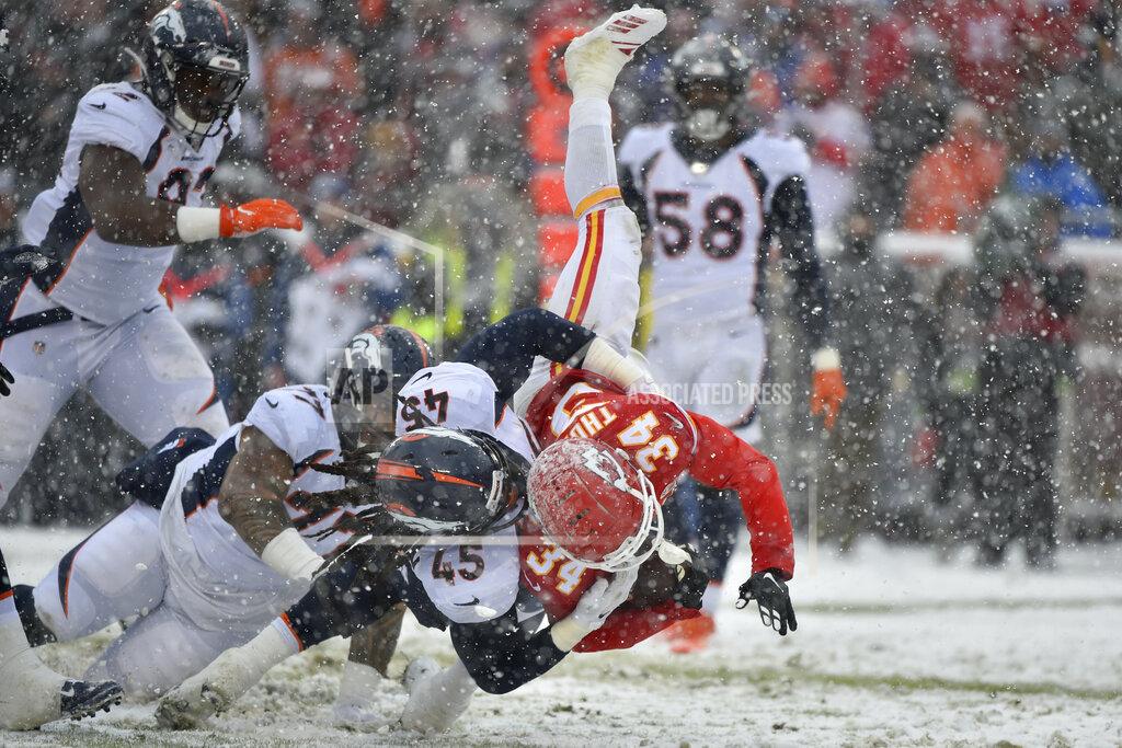 Ed Zurga Kansas City Chiefs running back Darwin Thompson (34) is tackled by Denver Broncos linebacker Alexander Johnson (45) during the second half of an NFL football game in Kansas City, Mo., Sunday, Dec. 15, 2019. (AP Photo/Ed Zurga)