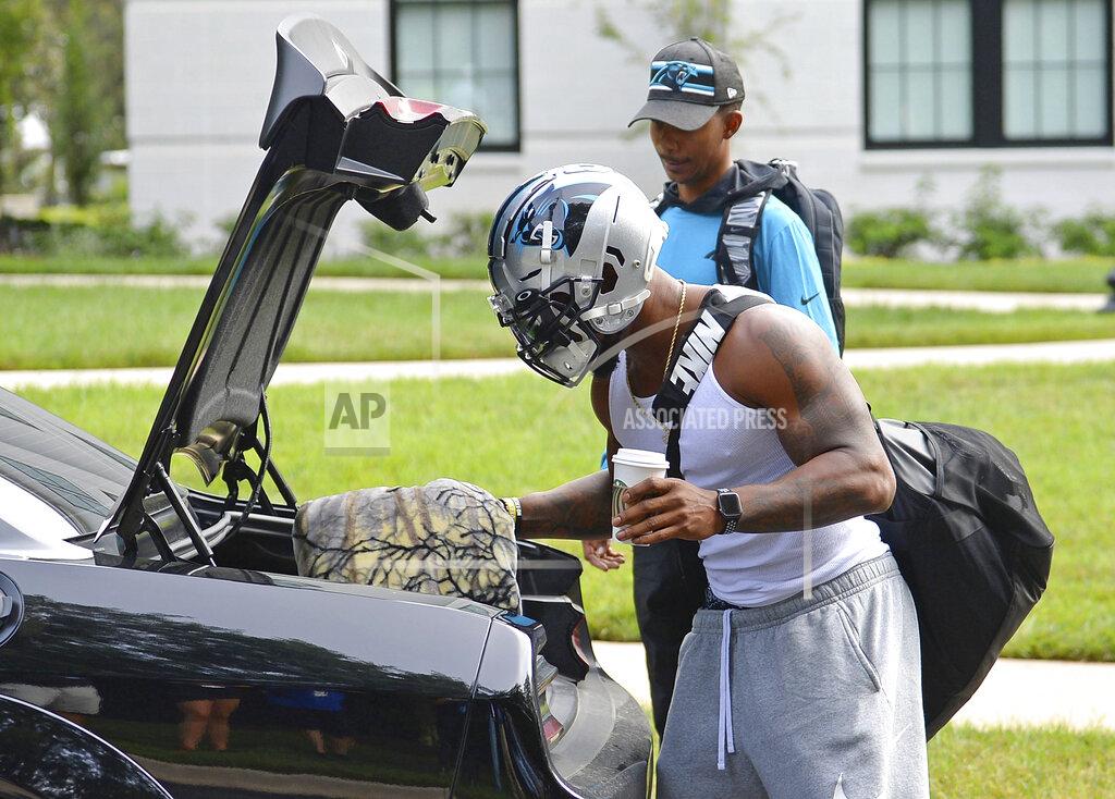Jeff Siner Carolina Panthers linebacker Denzel Perryman wears his football helmet as he unpacks at NFL football training camp, Tuesday, July 27, 2021, at Wofford College in Spartanburg, S.C. (Jeff Siner/The Charlotte Observer via AP)