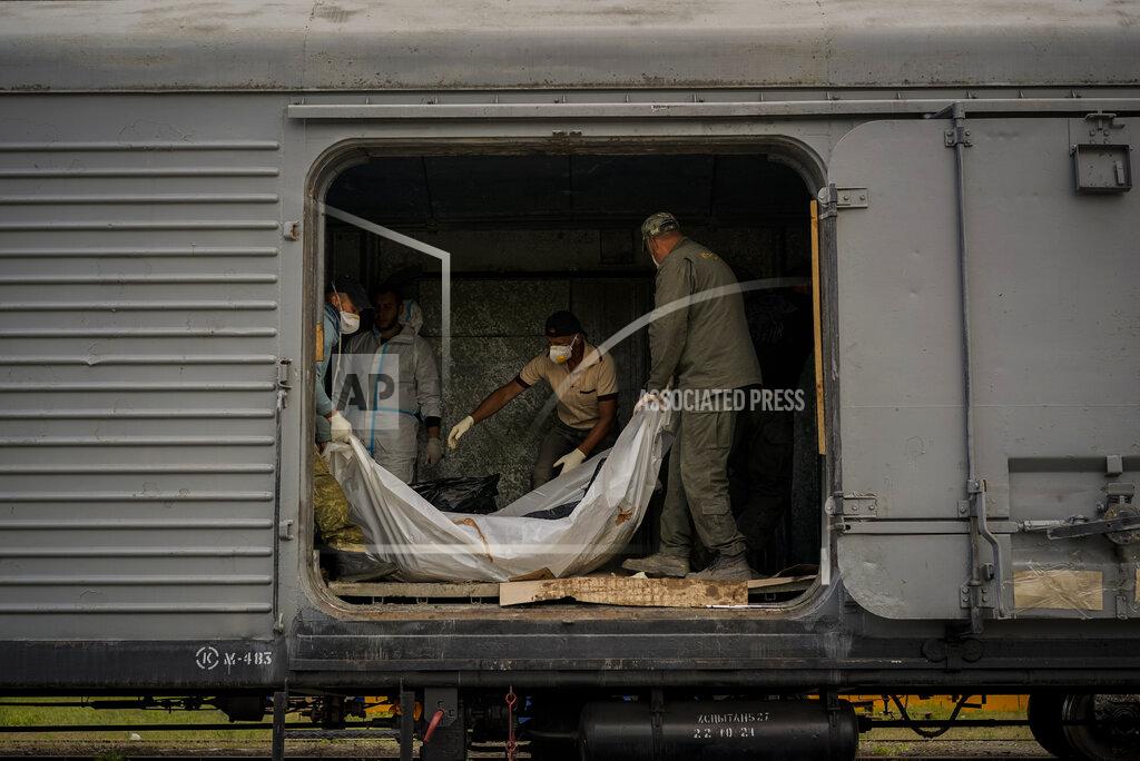 Bernat Armangue Forensic experts inspect bodies of dead Russian soldiers during an identification process in Kharkiv, east Ukraine, Tuesday, May 17, 2022. (AP Photo/Bernat Armangue)