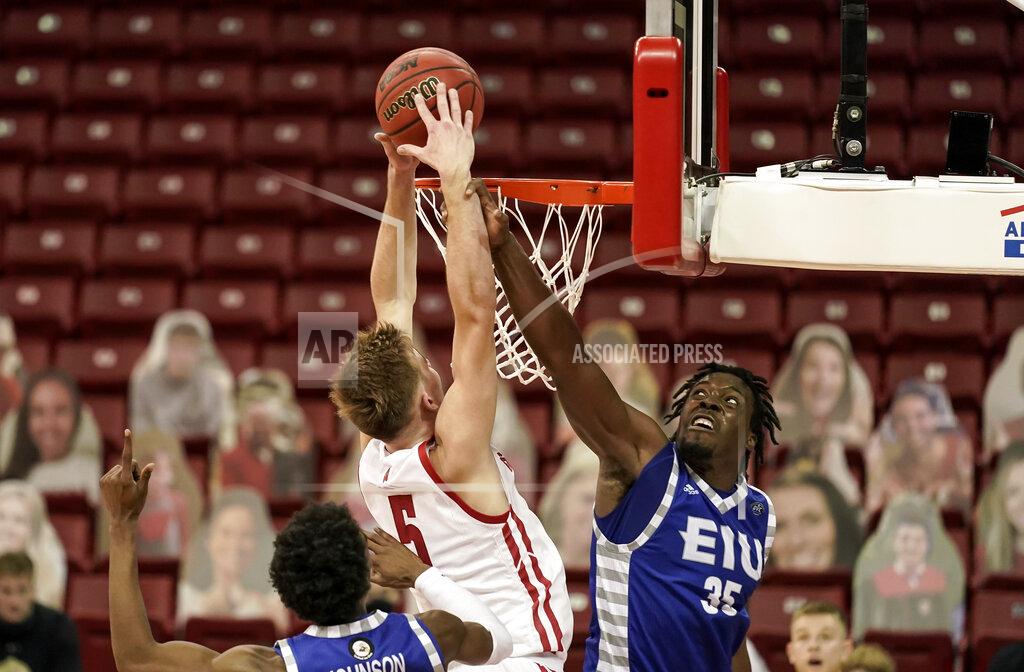 Andy Manis Eastern Illinois' George Dixon (35) defends against Wisconsin's Tyler Wahl (5) during the second half of an NCAA college basketball game Wednesday, Nov. 25, 2020, in Madison, Wis. Wisconsin won 77-67. (AP Photo/Andy Manis)