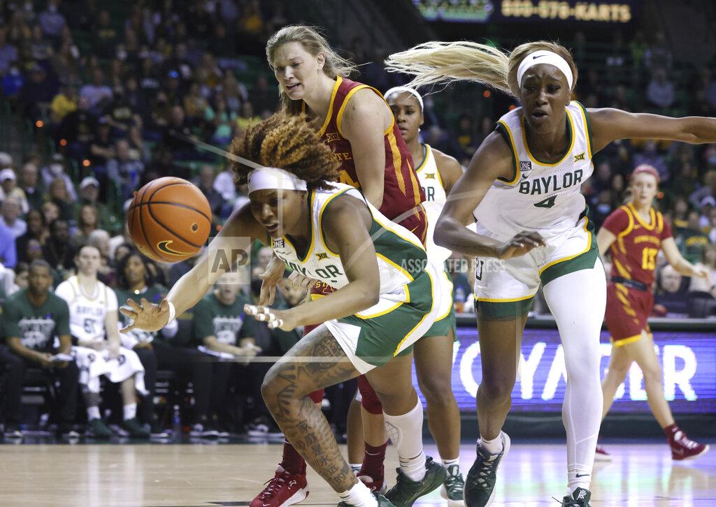 Rod Aydelotte Baylor forward NaLyssa Smith, left, chases after a loose ball with teammate Queen Egbo, right, and Iowa State guard Ashley Joens, center, in the first half of an NCAA college basketball game, Sunday, Jan. 23, 2022, in Waco, Texas. (Rod Aydelotte/Waco Tribune-Herald via AP)