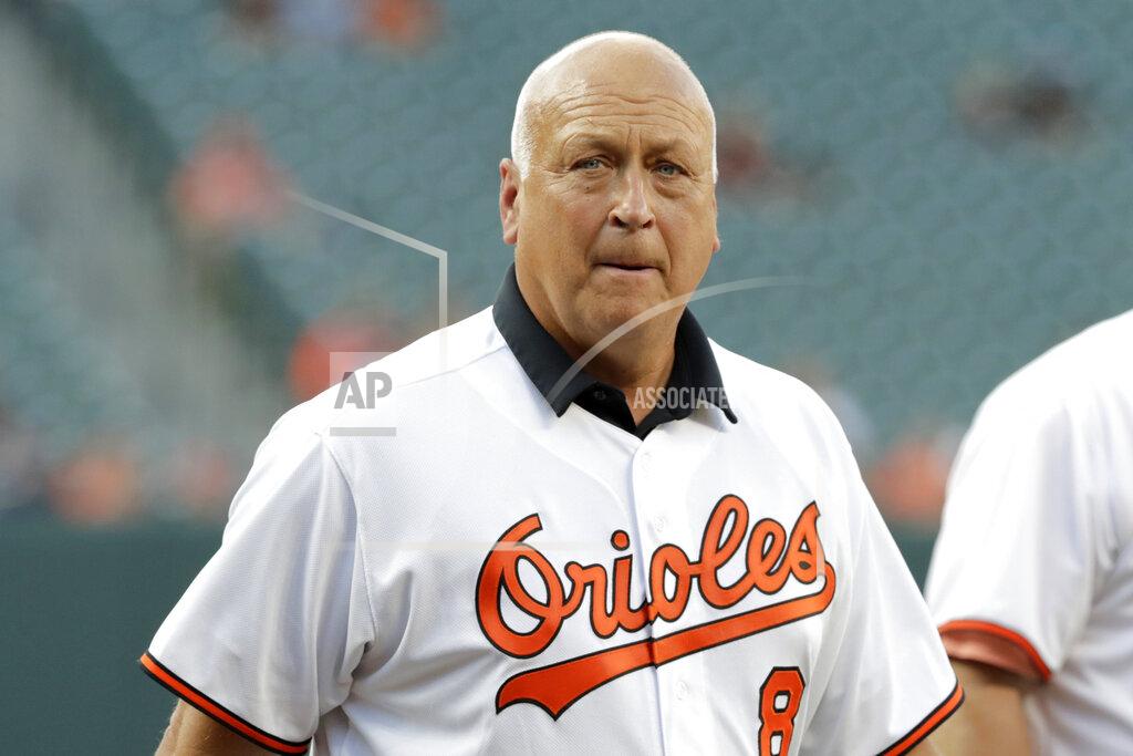 FILE - In this Aug. 9, 2019, file photo, former Baltimore Orioles infielder Cal Ripken, Jr. attends an on-field ceremony honoring the 1989 Orioles team prior to a baseball game against the Houston Astros, in Baltimore. Cal Ripken Jr. has launched a campaign to help feed children and families across the country during the COVID-19 pandemic, coordinating a contribution of $250,000 and opening a social media account for the first time to promote the cause.(AP Photo/Julio Cortez, File)