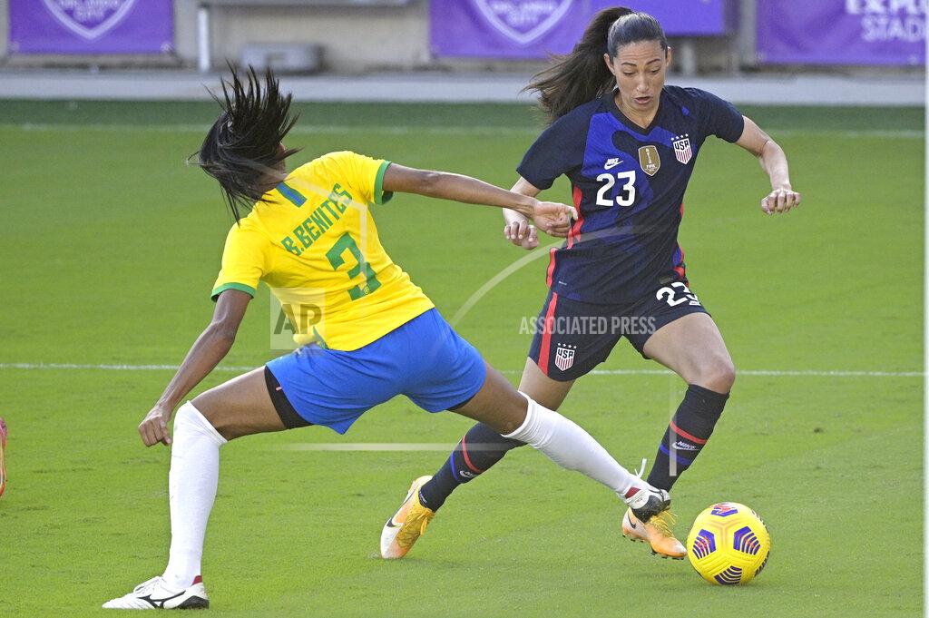 United States forward Christen Press (23) controls a ball in front of Brazil defender Bruna (3) during the second half of a SheBelieves Cup women's soccer match, Sunday, Feb. 21, 2021, in Orlando, Fla. (AP Photo/Phelan M. Ebenhack)