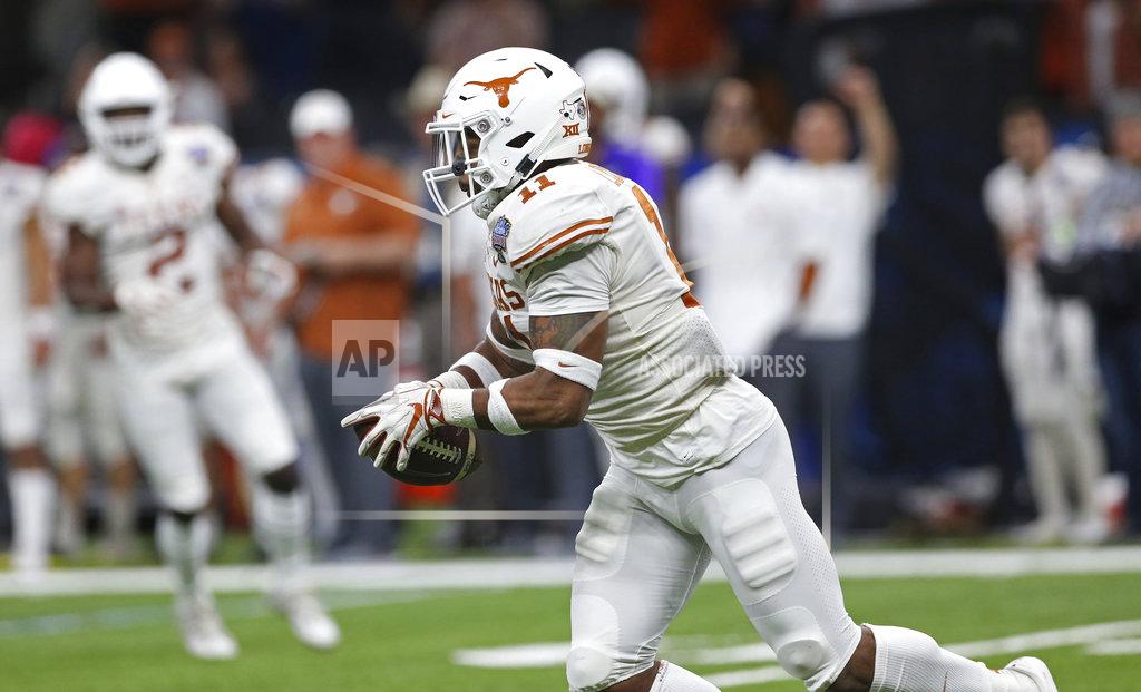 Rusty Costanza Texas defensive back P.J. Locke III (11) pulls in an interception of a Georgia pass during the second half of the Sugar Bowl NCAA college football game in New Orleans, Tuesday, Jan. 1, 2019. (AP Photo/Rusty Costanza)