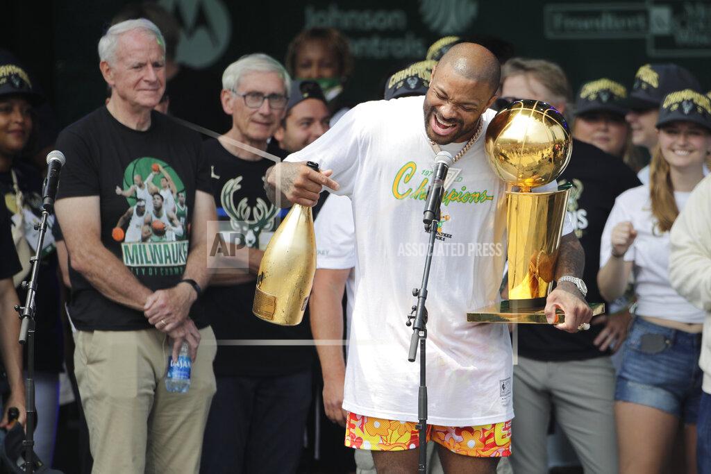 Aaron Gash FILE - Milwaukee Bucks' P.J. Tucker yells to the crowd as he holds the NBA Championship Trophy during a parade celebrating the team's basketball championship win, Thursday, July 22, 2021, in Milwaukee. Veteran NBA forward P.J. Tucker signed with Miami this summer, a move that brings his flashy off-court style and his tough on-court ways to the Heat. (AP Photo/Aaron Gash, File)