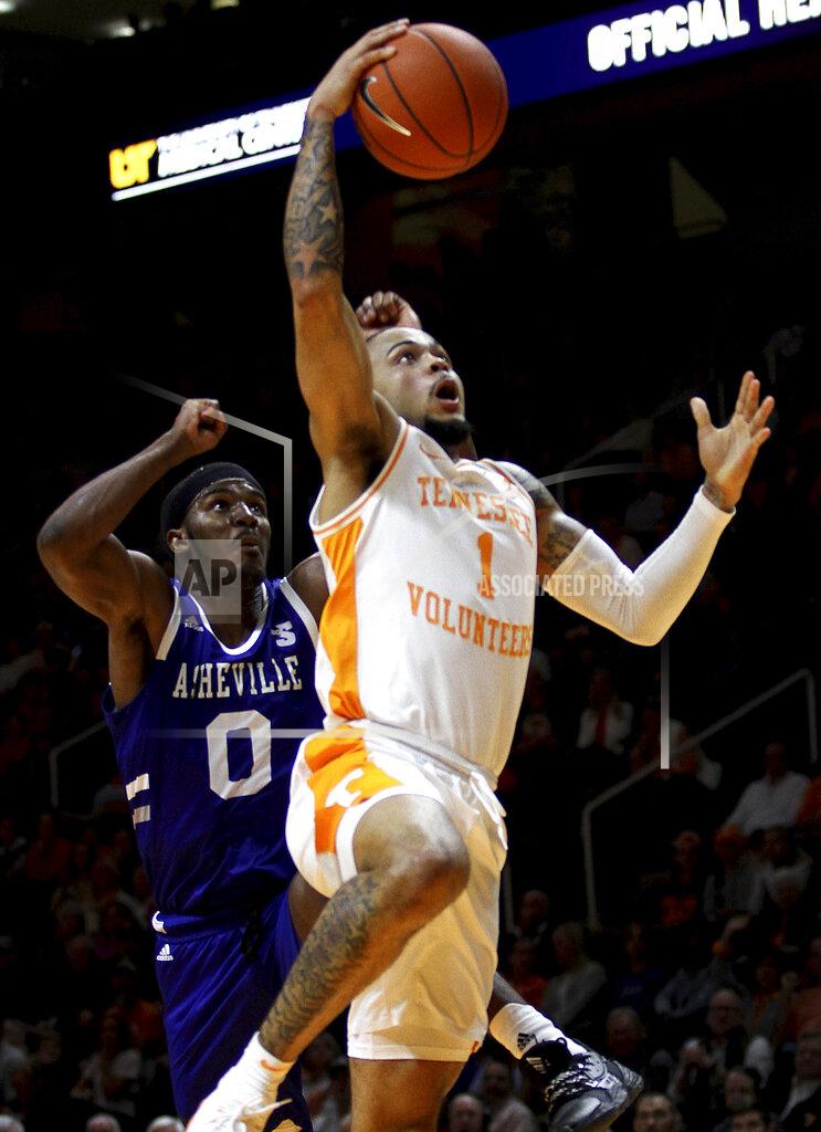 Tom Sherlin Tennessee's Lamonte Turner drives for a dunk in the lane against UNC Asheville's Trent Stephney during an NCAA college basketball game Tuesday, Nov. 5, 2019, in Knoxville, Tenn. (Tom Sherlin/The Daily Times via AP)
