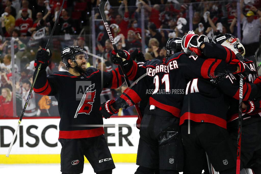 Karl B Deblaker Carolina Hurricanes' Vincent Trocheck (16) joins the celebration around goaltender Antti Raanta following their win over the Boston Bruins in Game 7 of an NHL hockey Stanley Cup first-round playoff series in Raleigh, N.C., Saturday, May 14, 2022. (AP Photo/Karl B DeBlaker)