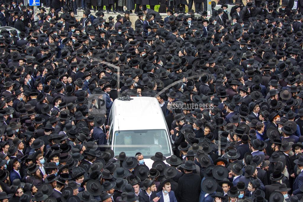 Ariel Schalit File - In this Sunday, Jan. 31, 2021 file photo, thousands of ultra-Orthodox Jews participate in funeral for prominent rabbi Meshulam Soloveitchik, in Jerusalem. The mass ceremony took place despite the country's health regulations banning large public gatherings, during a nationwide lockdown to curb the spread of the coronavirus. (AP Photo/Ariel Schalit, File)