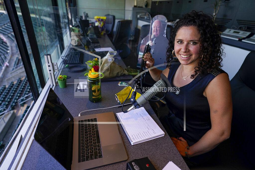 Tony Avelar Amelia Schimmel, the new public address announcer for the Oakland Athletics, sits in the press box before a baseball game against the Houston Astros, Thursday, April 1, 2021, on opening day in Oakland, Calif. Schimmel succeeds the late Dick Callahan, who passed away in January after serving as the team's PA announcer for 15 seasons. (AP Photo/Tony Avelar)