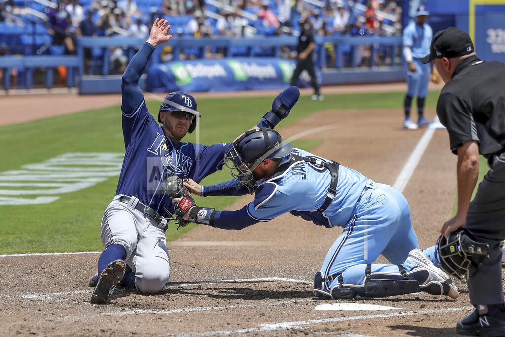 Mike Carlson Toronto Blue Jays catcher Danny Jansen tags out Tampa Bay Rays' Mike Brosseau as home plate umpire Jansen Visconti watches during the fourth inning of a baseball game Sunday, May 23, 2021, in Dunedin, Fla. (AP Photo/Mike Carlson)