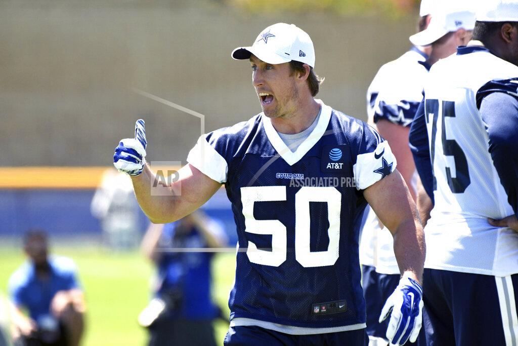 Dallas Cowboys linebacker Sean Lee (50) gives a thumbs-up to his teammates during practice at the NFL football team's training camp in Oxnard, Calif., Saturday, July 27, 2019. (AP Photo/Michael Owen Baker)