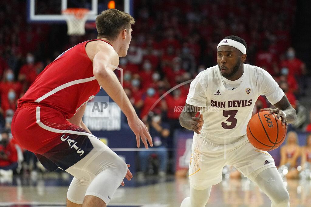 Rick Scuteri Arizona State guard Marreon Jackson (3) drives on Arizona forward Azuolas Tubelis during the first half of an NCAA college basketball game, Saturday, Jan. 29, 2022, in Tucson, Ariz. (AP Photo/Rick Scuteri)