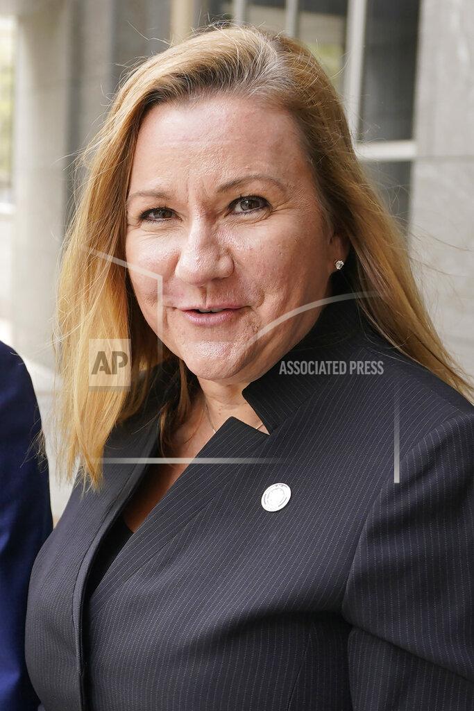 Steve Helber FILE This Thursday April 1, 2021 file photo shows Virginia State Sen. Amanda Chase, R-Chesterfield, right, leaves court during a break in a hearing to dismiss a lawsuit in Federal court in Richmond, Va. The GOP gubernatorial candidate will be chosen during the party's May 8 nominating convention. (AP Photo/Steve Helber)