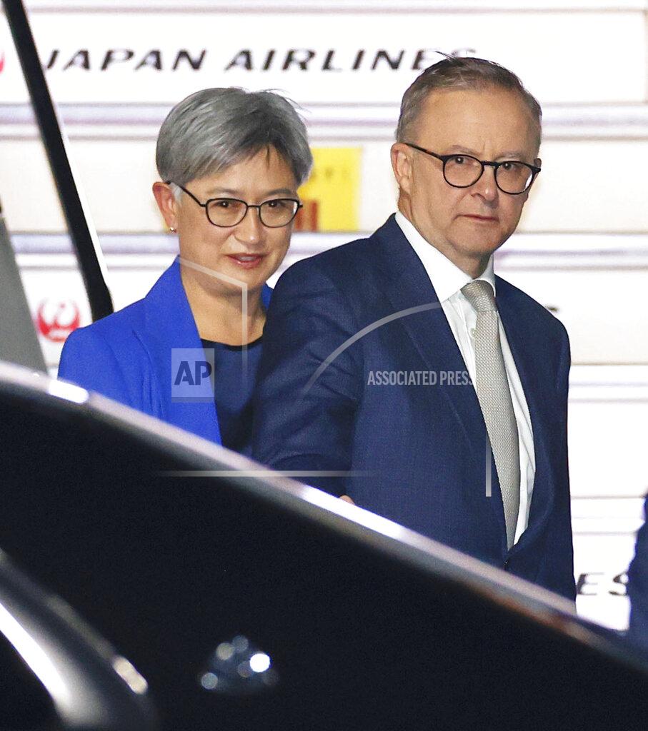 Fumine Tsutabayashi Australian Prime Minister Anthony Albanese, right, and Foreign Minister Penny Wong arrive at Haneda International Airport in Tokyo, Monday, May 23, 2022. The newly sworn-in Australian Prime Minister Albanese is scheduled to attend a gathering in Tokyo of the four-country Indo-Pacific group known as the Quad.(Fumine Tsutabayashi/Kyodo News via AP)