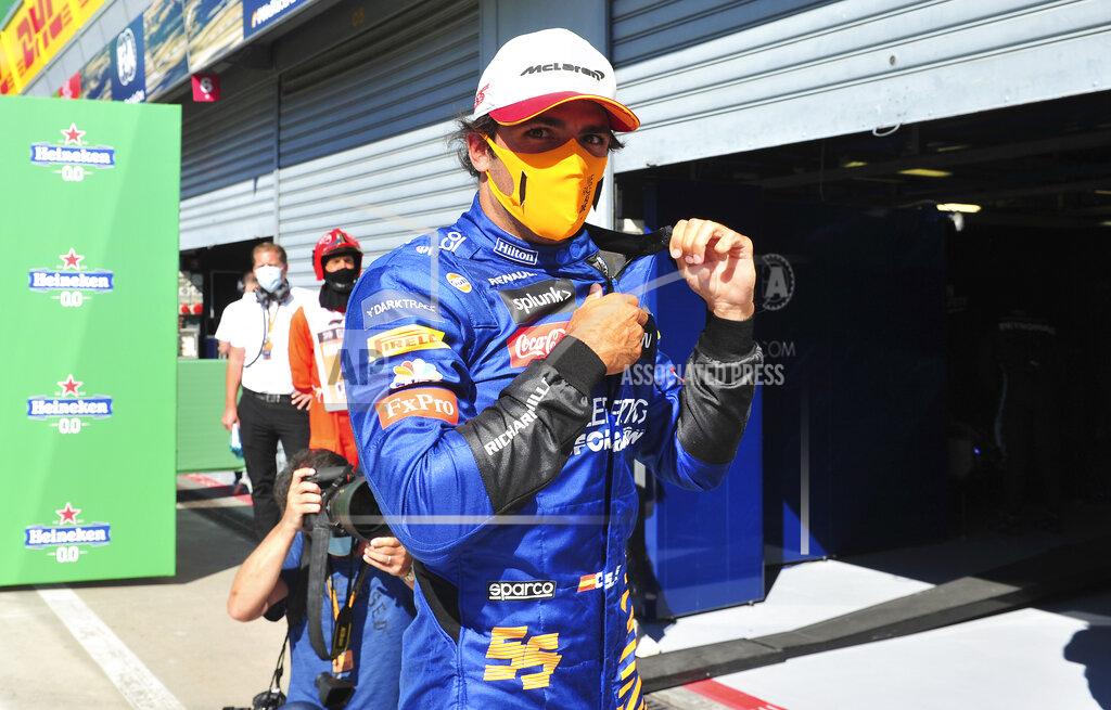 Jennifer Lorenzini Mclaren driver Carlos Sainz of Spain walks on the pit line after clocking the third fastest time during the qualifying session for Sunday's Italian Formula One Grand Prix, at the Monza racetrack in Monza, Italy, Saturday, Sept. 5, 2020. (Jennifer Lorenzini/Pool via AP)
