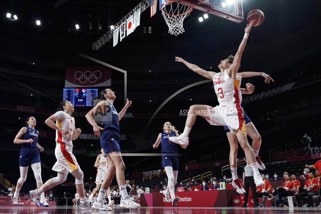 Eric Gay China's Liwei Yang (3) is fouled as she drives to the basket against Serbia during a women's basketball quarterfinal game at the 2020 Summer Olympics, Wednesday, Aug. 4, 2021, in Saitama, Japan. (AP Photo/Eric Gay)