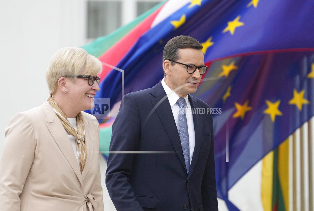 Czarek Sokolowski Lithuanian Prime Minister Ingrida Simonyte, left, being greeted by Poland's Prime Minister Mateusz Morawiecki on a visit for talks that include the region's security in the face of migrant pressure on the two countries' borders with Belarus, in Warsaw, Poland, on Friday, Sept. 17, 2021. (AP Photo/Czarek Sokolowski)
