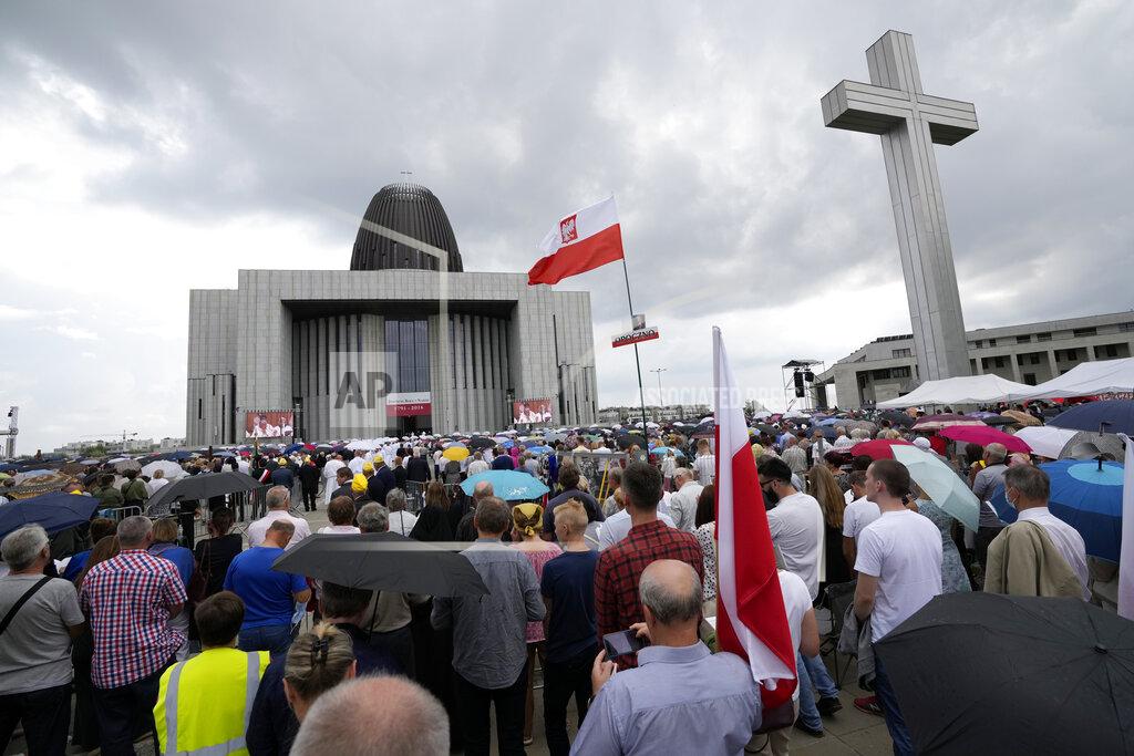 Czarek Sokolowski Catholic faithful attend the beatification ceremony of Polish Cardinal Stefan Wyszynski and Mother Elzbieta Roza Czacka in front of the church of Providence in Warsaw, Poland, Sunday, Sept. 12, 2021. Poland's top political leaders gathered in a Warsaw church Sunday for the beatification of two revered figures of the Catholic church — a cardinal who led the Polish church's resistance to communism and a blind nun who devoted her life to helping others who couldn't see. (AP Photo/Czarek Sokolowski)