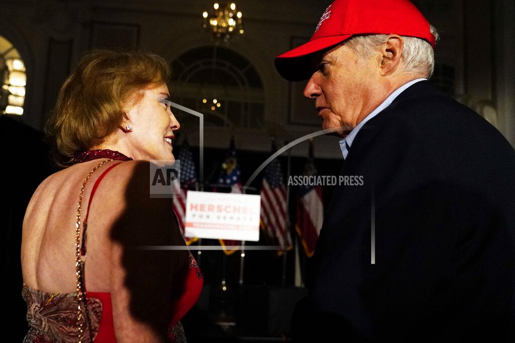 Brynn Anderson Supporters wait to hear U.S. Senate candidate Herschel Walker during an election night watch party, Tuesday, May 24, 2022, in Atlanta. Walker won the Republican nomination for U.S. Senate in Georgia's primary election. (AP Photo/Brynn Anderson)