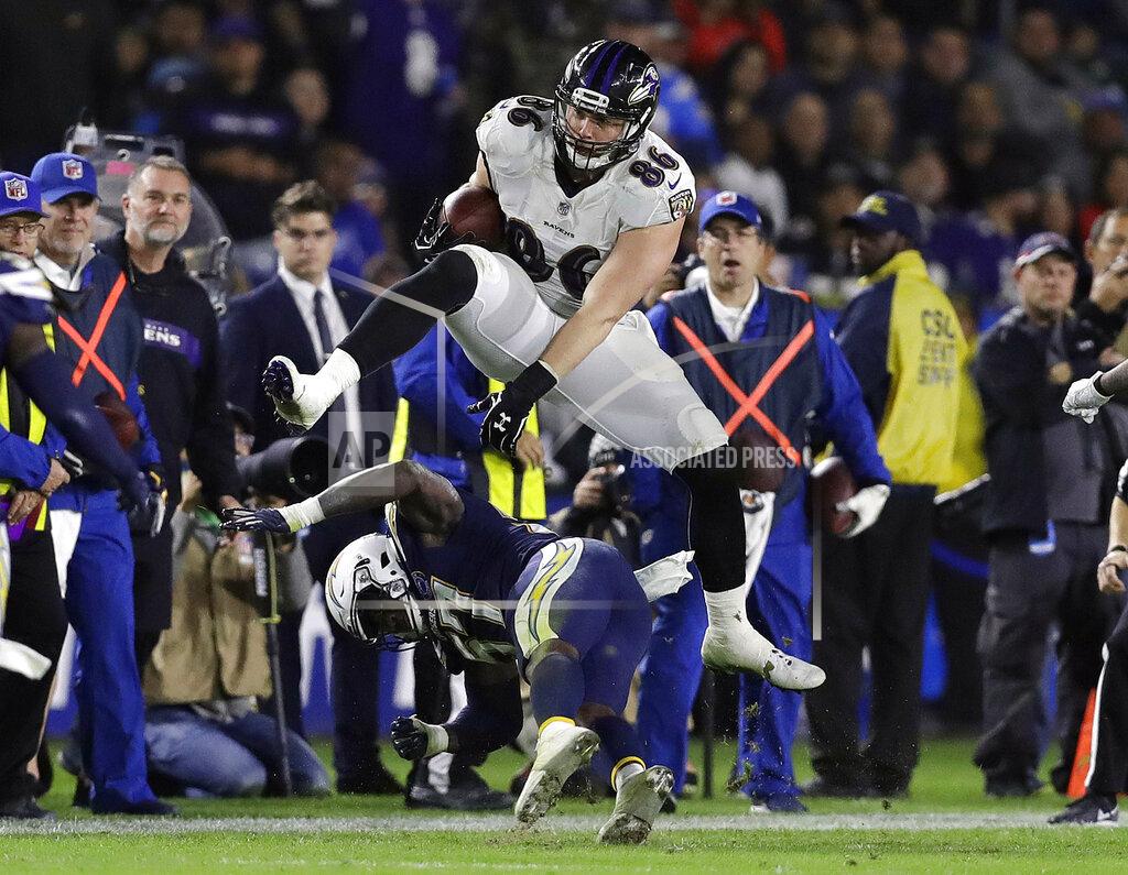 Marcio Jose Sanchez FILE - In this Dec. 22, 2018, file photo, Baltimore Ravens tight end Nick Boyle, top, leaps over Los Angeles Chargers outside linebacker Jatavis Brown during an NFL football game, in Carson, Calif. The Ravens have signed Nick Boyle to a three-year contract, the latest in a series of moves by first-year general manager Eric DeCosta during a busy offseason.
Though Boyle has not scored a touchdown over his four NFL seasons, the 6-foot-4, 270-pounder has value that transcends catches and scores.(AP Photo/Marcio Jose Sanchez, File)