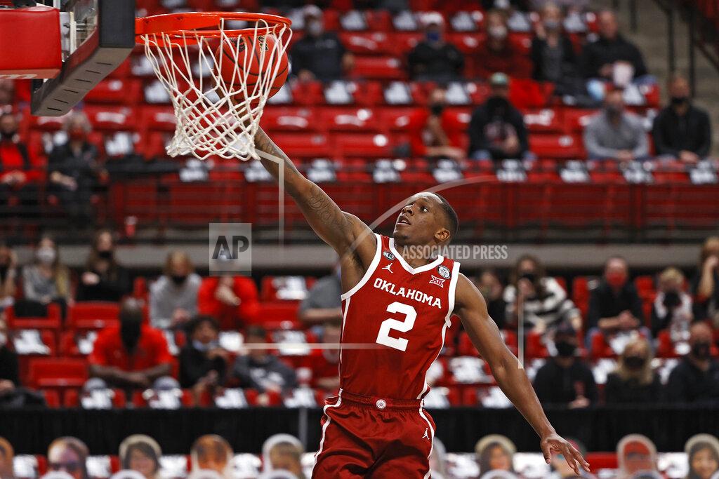 Brad Tollefson Oklahoma's Umoja Gibson (2) lays up the ball during the first half of an NCAA college basketball game against Texas Tech, Monday, Feb. 1, 2021, in Lubbock, Texas. (AP Photo/Brad Tollefson)