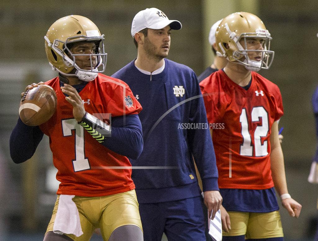Robert Franklin FILE - In this March 6, 2018, file photo, Notre Dame quarterback Brandon Wimbush (7) looks to throw the ball next to quarterbacks coach Tom Reese and teammate Ian Book (12) during NCAA college football practice in South Bend, Ind. Two people familiar with the decision say No. 3 Notre Dame will start Wimbush against Florida State on Saturday for Book, who is nursing an undisclosed injury. The people spoke Thursday, Nov. 8, 2018, to The Associated Press on condition of anonymity to because no official announcement was forthcoming. Notre Dame coach Brian Kelly had a scheduled news conference later Thursday. (Robert Franklin/South Bend Tribune via AP, File)