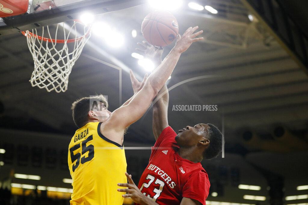 Charlie Neibergall Rutgers guard Montez Mathis (23) is fouled by Iowa center Luka Garza (55) while driving to the basket during the first half of an NCAA college basketball game, Wednesday, Jan. 22, 2020, in Iowa City, Iowa. (AP Photo/Charlie Neibergall)