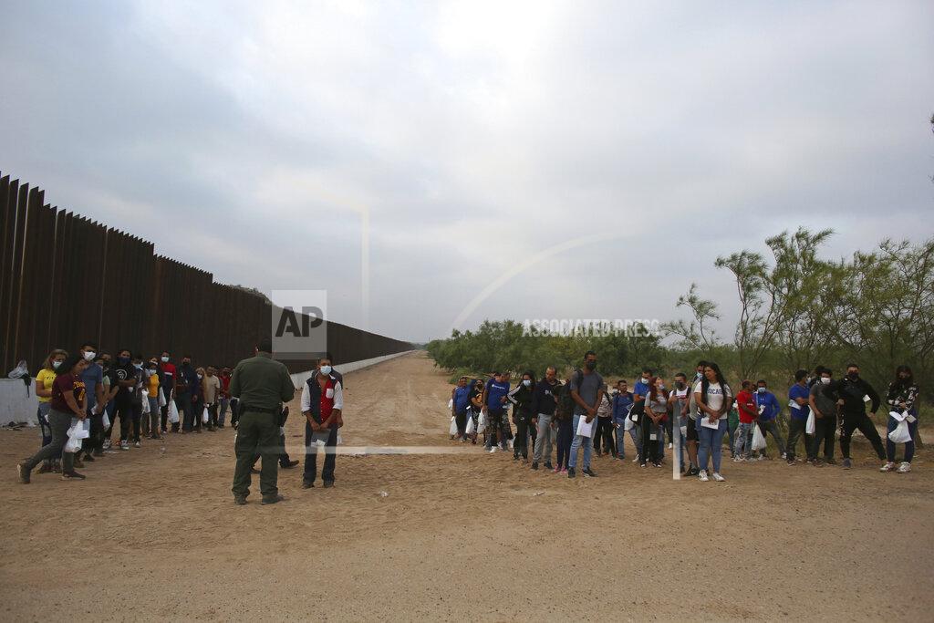Dario Lopez-Mills A Border Patrol agent instructs migrants who had crossed the Rio Grande river into the U.S. in Eagle Pass, Texas, Friday, May 20, 2022. As U.S. officials anxiously waited, many of the migrants crossing the border from Mexico on Friday were oblivious to a pending momentous court ruling on whether to maintain pandemic-related powers that deny a chance to seek asylum on grounds of preventing the spread of COVID-19. (AP Photo/Dario Lopez-Mills)