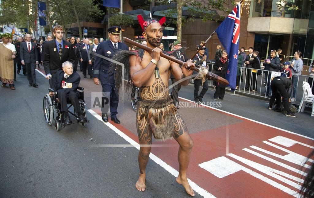 Mark Baker A New Zealand Maori warrior marches during the Anzac Day parade in Sydney, Australia, Sunday, April 25, 2021. Australians and New Zealanders paid tribute to their war dead Sunday as both nations prepared to withdraw from their longest war in Afghanistan. (AP Photo/Mark Baker)