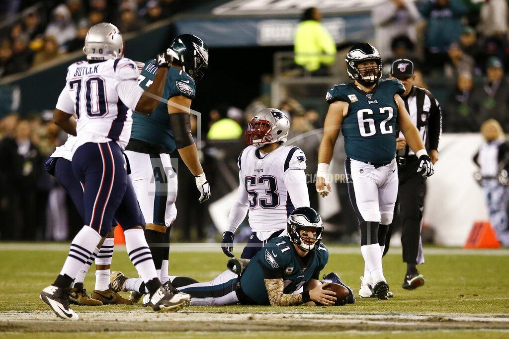 Michael Perez Philadelphia Eagles' Carson Wentz (11) lies on the field after being tackled by New England Patriots' Kyle Van Noy (53) during the first half of an NFL football game, Sunday, Nov. 17, 2019, in Philadelphia. (AP Photo/Michael Perez)