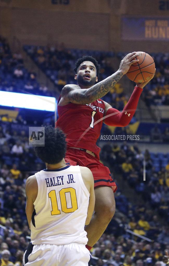 Ray Thompson Texas Tech guard Brandone Francis (1) drives as West Virginia guard Jermaine Haley (10) attempts to draw a foul during the first half of an NCAA college basketball game Wednesday, Jan. 2, 2019, in Morgantown, W.Va. (AP Photo/Raymond Thompson)
