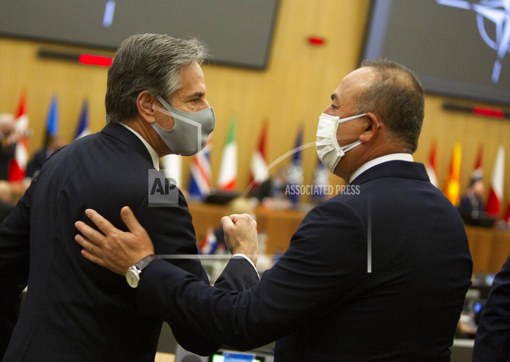 Virginia Mayo U.S. Secretary of State Antony Blinken, left, speaks with Turkish Foreign Minister Mevlut Cavusoglu during a meeting of NATO foreign ministers at NATO headquarters in Brussels on Tuesday, March 23, 2021. (AP Photo/Virginia Mayo, Pool)