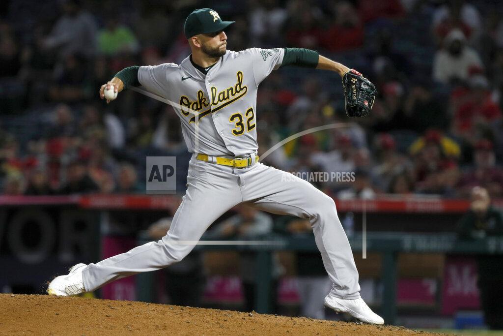 Alex Gallardo Oakland Athletics starting pitcher James Kaprielian winds up during the fifth inning of the team's baseball game against Los Angeles Angels in Anaheim, Calif., Saturday, Sept. 18, 2021. (AP Photo/Alex Gallardo)