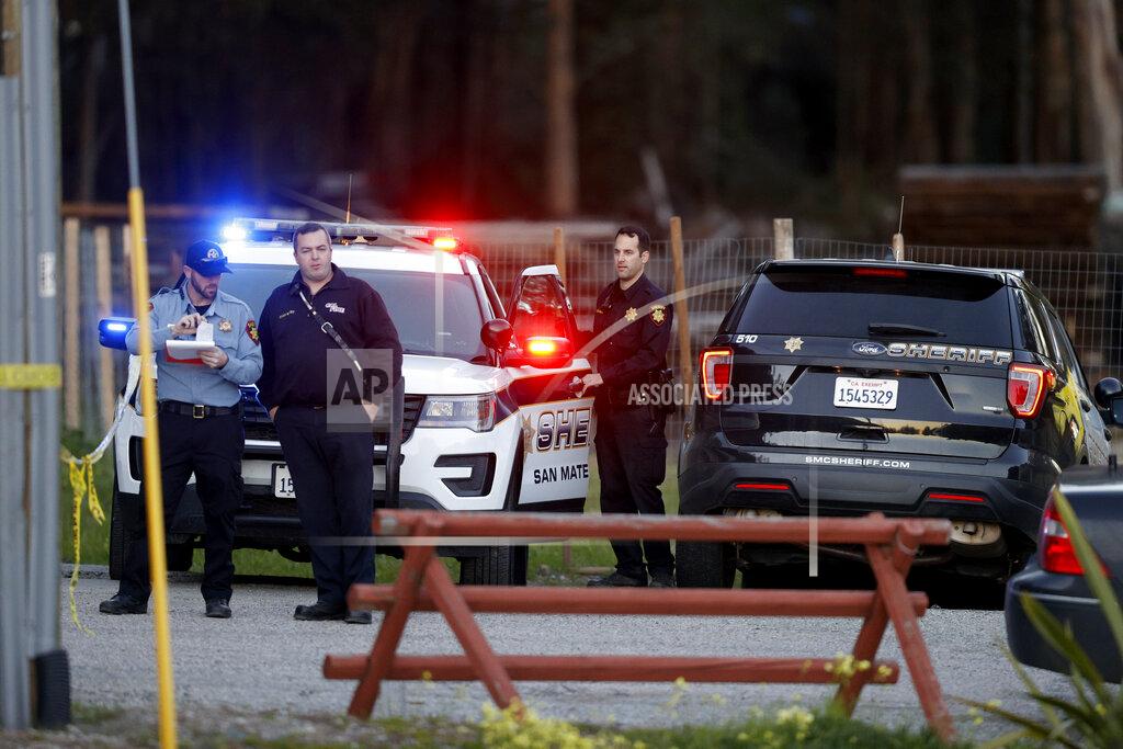 Carlos Gonzalez San Mateo County Sheriffs officers and EMS personnel gather along a road at a location near where multiple people were found shot to death on Monday, Jan. 23, 2023, in Half Moon Bay, Calif. (Carlos Gonzalez/San Francisco Chronicle via AP)