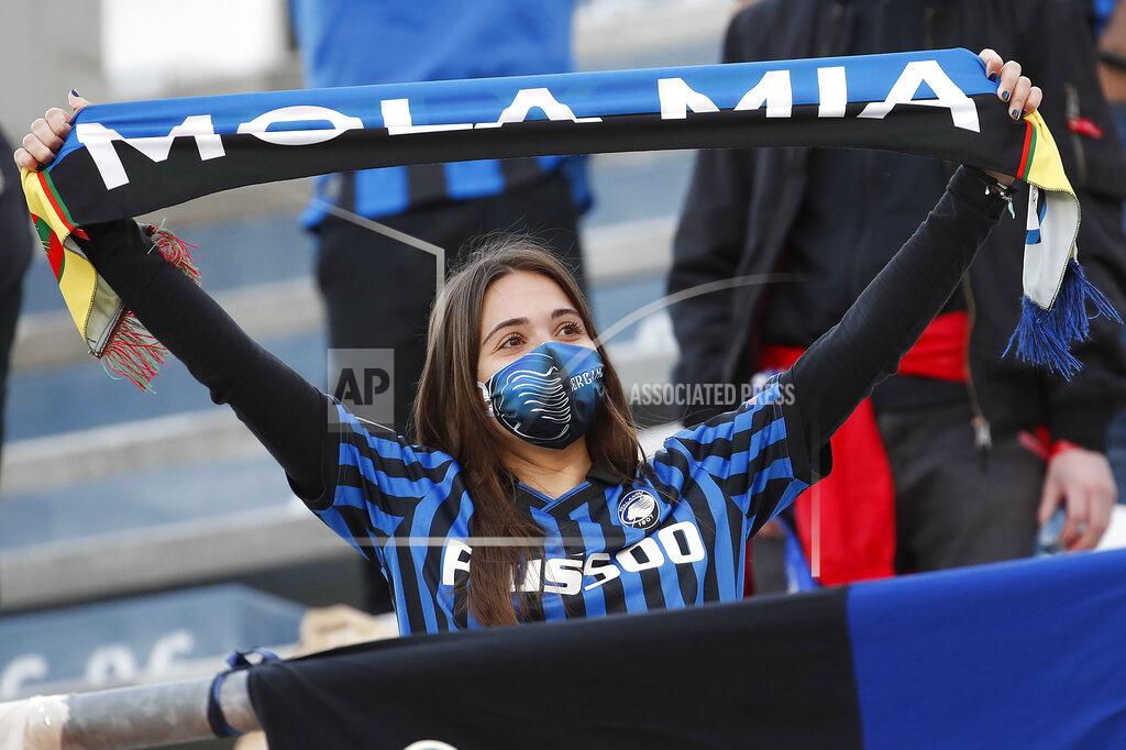 Antonio Calanni Atalanta fan wearing face protection mask is seen before the Italian Cup soccer final match between Atalanta and Juventus at the Mapei Stadium in Reggio Emilia, Italy, Wednesday, May 19, 2021. (AP Photo/Antonio Calanni)