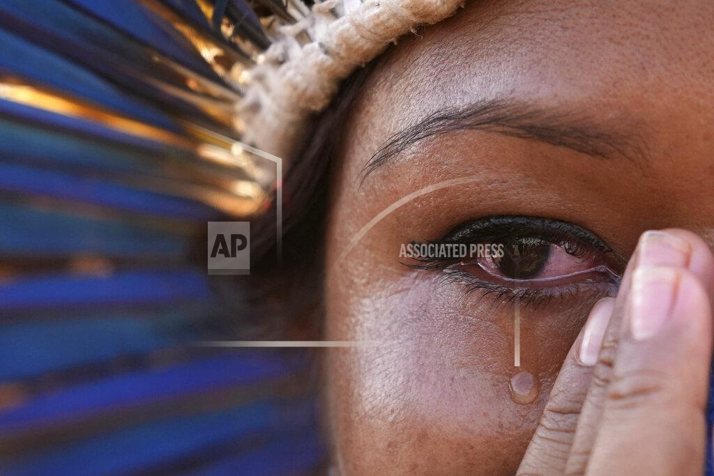 Eraldo Peres An Indigenous woman cries after the Supreme Court judges' decision to suspend the vote that defines the demarcation of Indigenous lands, during a protest in front of the Supreme Court building, in Brasilia, Brazil, Wednesday, Sept. 15, 2021. (AP Photo/Eraldo Peres)