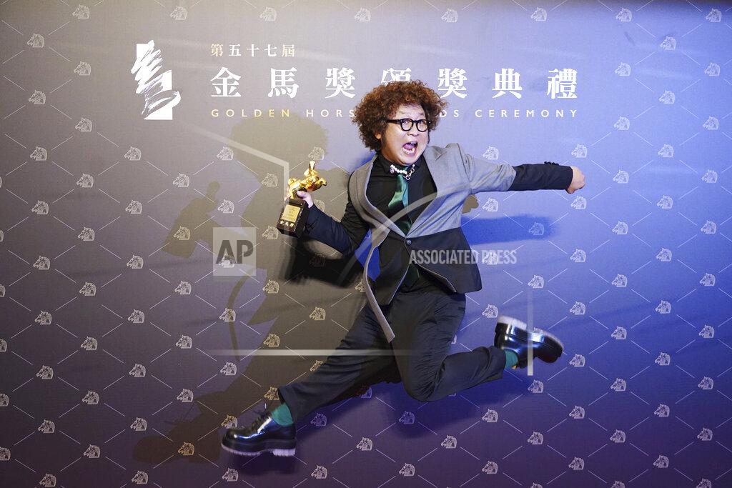 Billy Dai Taiwanese actor Nadow Lin holds his award for Best Supporting Actor at the 57th Golden Horse Awards in Taipei, Taiwan, Saturday, Nov. 21, 2020. Lin won for the film "Classmates Minus" at this year's Golden Horse Awards. (AP Photo/Billy Dai)