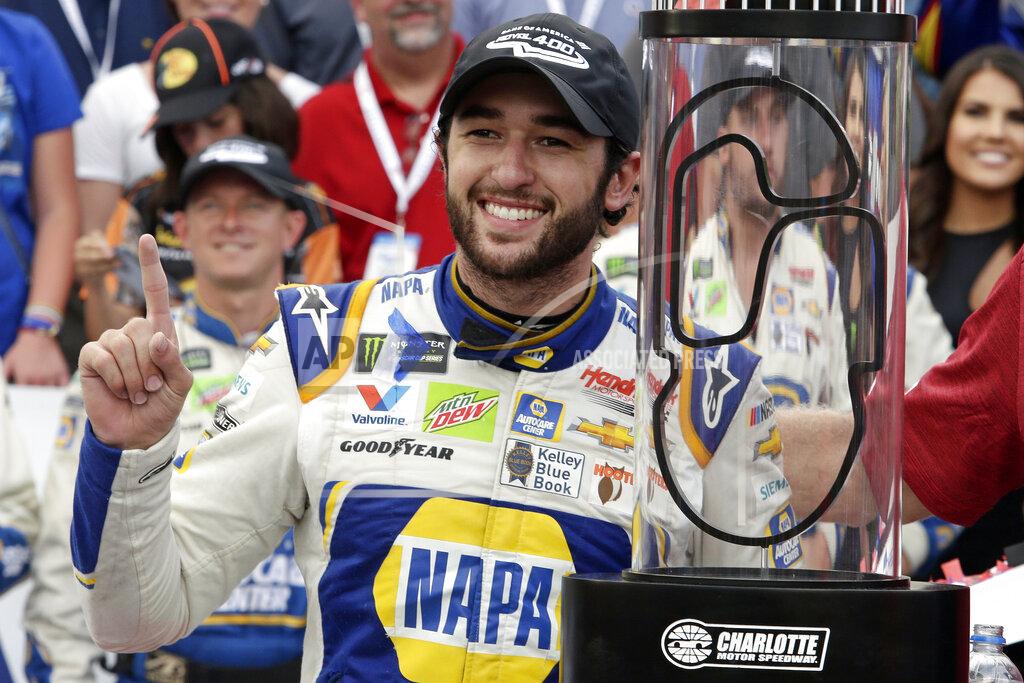 Wesley Broome Chase Elliott poses with the trophy after winning the NASCAR Cup Series auto race at Charlotte Motor Speedway in Concord, N.C., Sunday, Sept. 29, 2019. (AP Photo/Wesley Broome)