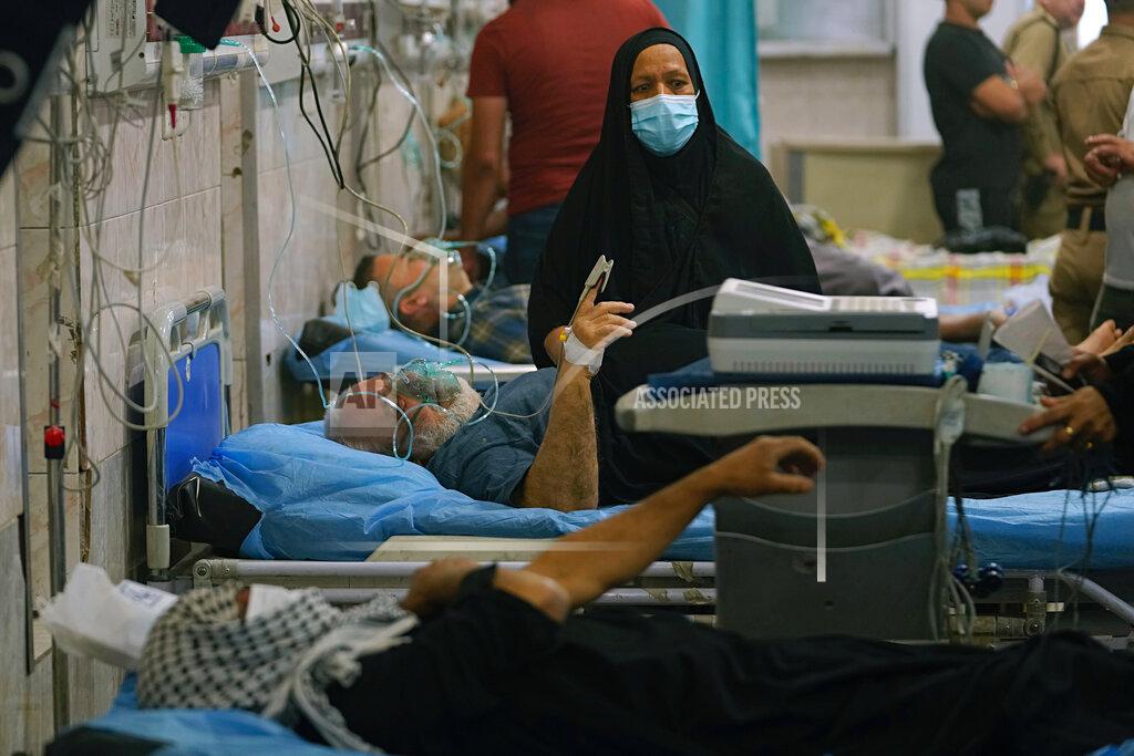 Hadi Mizban People with breathing problems are treated at a hospital during a sandstorm in Baghdad, Iraq, Monday, May 23, 2022. (AP Photo/Hadi Mizban)