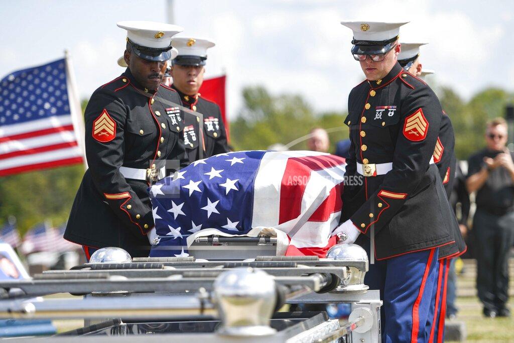 Jonah Hinebaugh Marine Corps honor guards prepare to place Marine Cpl. Humberto Sanchez' casket on a lowering device during the graveside service at Mount Hope Cemetery in Logansport, Ind., on Tuesday, Sept. 14, 2021. Sanchez was one of 13 U.S. service members killed in last month's suicide bombing at Afghanistan’s Kabul airport during the U.S.-led evacuation. (Jonah Hinebaugh/The Pharos-Tribune via AP)