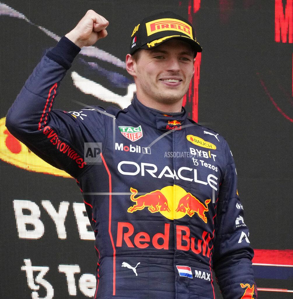 Luca Bruno Red Bull driver Max Verstappen, of the Netherlands, celebrates on the podium after winning the Emilia Romagna Formula One Grand Prix, at the Enzo and Dino Ferrari racetrack, in Imola, Italy, Sunday, April 24, 2022. (AP Photo/Luca Bruno)