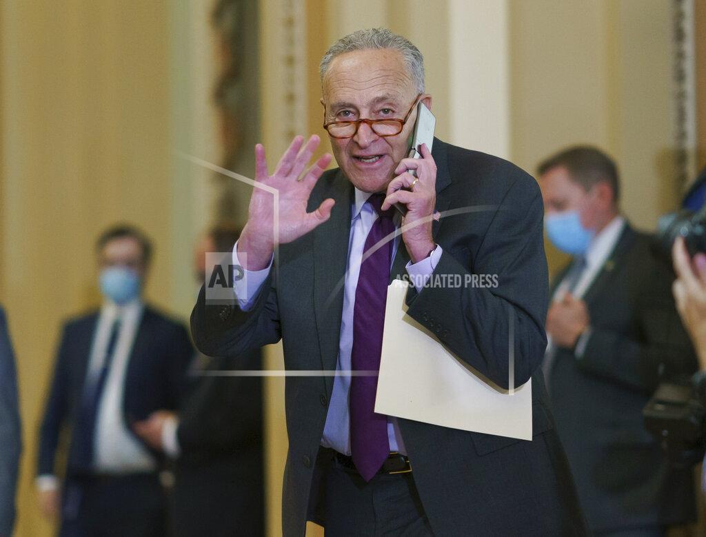 J. Scott Applewhite Senate Majority Leader Chuck Schumer, D-N.Y., pauses for a vote before speaking to reporters as work continues on the Democrats' Build Back Better Act, massive legislation that is a cornerstone of President Joe Biden's domestic agenda, at the Capitol in Washington, Tuesday, Sept. 14, 2021. (AP Photo/J. Scott Applewhite)