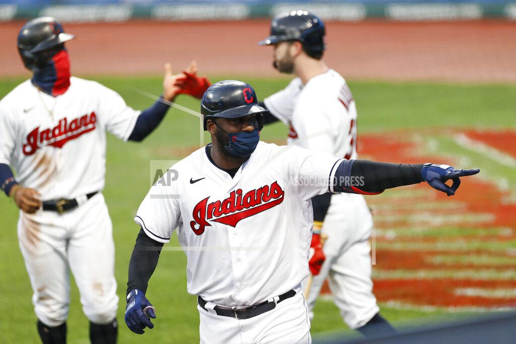 Ron Schwane Cleveland Indians' Franmil Reyes celebrates after hitting a two-run home run off Detroit Tigers starting pitcher Michael Fulmer during the third inning of a baseball game, Friday, Aug. 21, 2020, in Cleveland. (AP Photo/Ron Schwane)