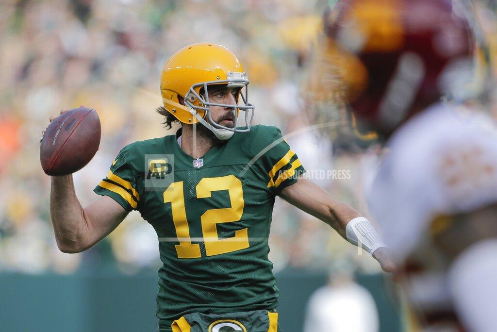 Aaron Gash Green Bay Packers' Aaron Rodgers thorws during the first half of an NFL football game against the Washington Football Team Sunday, Oct. 24, 2021, in Green Bay, Wis. (AP Photo/Aaron Gash)