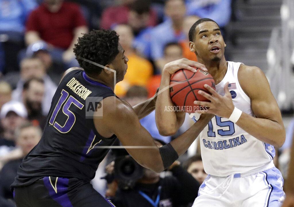 Tony Dejak North Carolina's Garrison Brooks (15) looks to shoot against Washington's Noah Dickerson (15) in the second half during a second-round men's college basketball game in the NCAA Tournament in Columbus, Ohio, Sunday, March 24, 2019. (AP Photo/Tony Dejak)