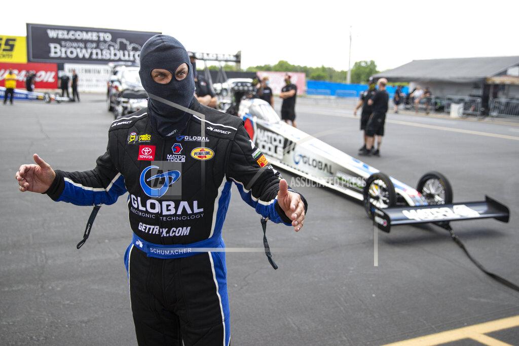 Michael Conroy Tony Schumacher prepares for a run in Top Fuel during practice for an NHRA drag racing event in Brownsburg, Ind., Friday, July 10, 2020. The NHRA returned to action last weekend near Indianapolis, in front of fans, on network television and amid hopes of a quick financial rebound following a 138-day season suspension. It was the kind of boost everybody needed. Teams and crew members are scrambling to pay the bills. Big questions remain for the world's premier drag-racing series. The pandemic is still a threat to disrupt the season or shut it down again. (AP Photo/Michael Conroy)