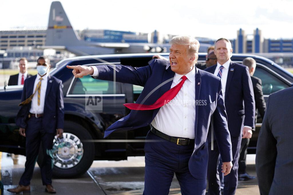 Alex Brandon President Donald Trump gestures to supporters as he arrives at Minneapolis Saint Paul International Airport, Wednesday, Sept. 30, 2020, in Minneapolis. (AP Photo/Alex Brandon)